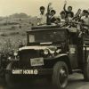 Mountain View College (Philippines) students riding their weapon carrier donated by the Quiet Hour