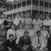 Mount Vernon Academy English 9 class, 1913-1914, with perhaps a dormitory in the background