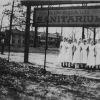 Hinsdale Sanitarium and Hospital nurses by the Hinsdale Sanitarium sign