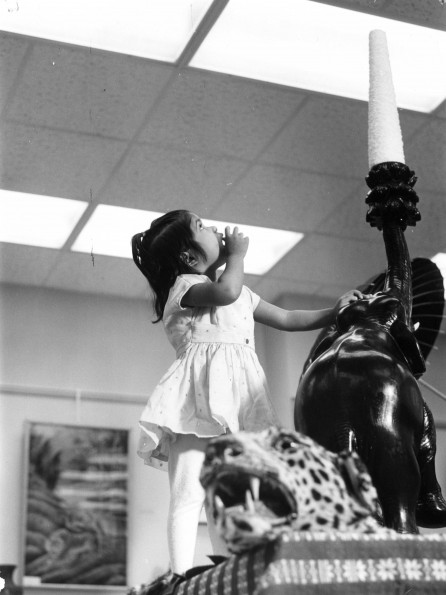 Jeanie John, daughter of Austin John from Pakistan, gets a good look at objects from the Southern Asia Division as part of the World Mission Exhibit at Andrews University Feb. 21 thru Mar. 1, 1967