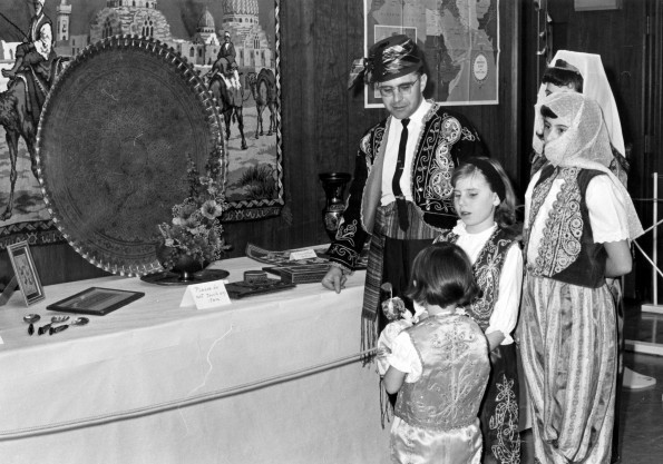 Curtis Miller and family view an exhibit as part of the World Mission Exhibit at Andrews University Feb. 21 thru Mar. 1, 1967