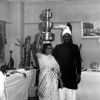 Justin Singh and wife from India demonstrate carrying pot on your head as part of the World Mission Exhibit at Andrews University Feb. 21 thru Mar. 1, 1967