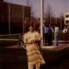 Andrews University president Joseph Grady Smoot under the American Flag pole behind Pioneer Memorial Church