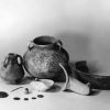 [Ancient pottery and other objects on display in the Andrews University Archaeological Museum]