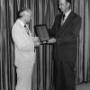 [Edward C. Banks receives an award recognizing his educational work in the area of evangelism]