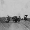 Chinese road with horse and people drawn carts