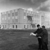 V. E. Garber and John Kriley study blueprints at the construction site of new Andrews University Administration building