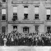 [Seventh-day Adventist Central Publishing House staff pose in front of their building]