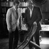 [Donald Prior and H. H. Hill with a chair designed by John Harvey Kellogg]
