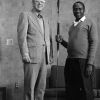 [Richard Hammill and John Kisaka standing with a Tanzanian spear]