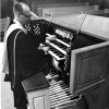 [C. Warren Becker plays the organ at a dedication service at Pioneer Memorial Church]