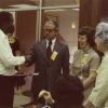 [Floyd Costerisan, Elsie Landon Buck, and Horace J. Shaw welcoming new graduates to the Alumni Association]