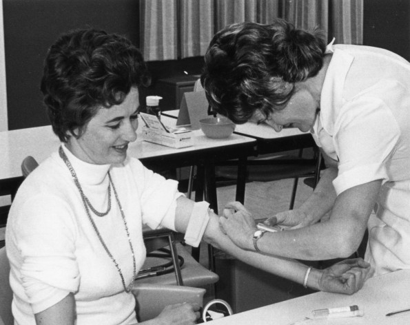 [Beverly Denton giving Hazel Schmidt a blood test during Andrews University's 3C's testing program]