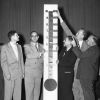 [Gentlemen standing with the 1953 ingathering goal meter]