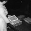 [Mary Jane Mitchell looking at some old Bibles donated to the James White Library]