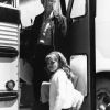 [Alvin Perrine standing with a young girl ready to leave for Scott Lake Camp]