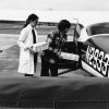 [Lois Miller and Terry Copsey loading blood samples into an airplane at the Andrews University Airport]