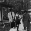 [Gene and Marie Jennings, members of the Christian band,  Ponder, Harp, & Collins,  and who played at the 1972 Andrews University alumni retreat in Florida, are seen walking with their child asleep in the stroller.]