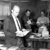 [Richard Powell, Larry I. Bergstrom, and Donna Stout looking over the book display in the James White Library]
