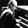 [C. Warren Becker plays the organ at a dedication service at Pioneer Memorial Church]
