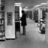 [Library patron in the stacks of James White Library at Andrews University]