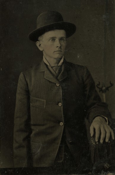Young unknown man in hat
