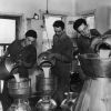 [Three unknown men working at the Emmanuel Missionary College dairy]