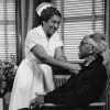 [Edna L. Ford nursing an elderly man in the Riverside Sanitarium, Nashville, TN]