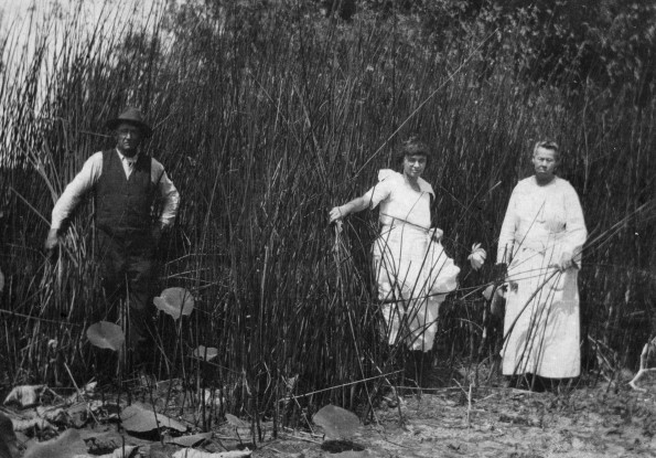 [Mary Kate Gafford with her mother and step-father, Jean and Mary Ashlock, among the reeds at Katy Lake near Waco, Texas]