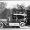 [Uriah Wilton Smith in his Ford Model T Touring car with others, probably preparing to leave on a journey]