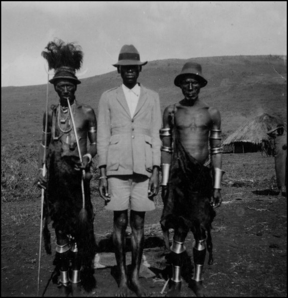 Christian native flanked by Kisii tribesmen