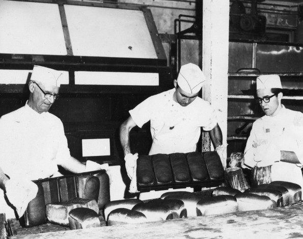 [John Brownlee and two unknown men baking bread]