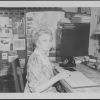 Bessie DeGraw working in an office of Madison College