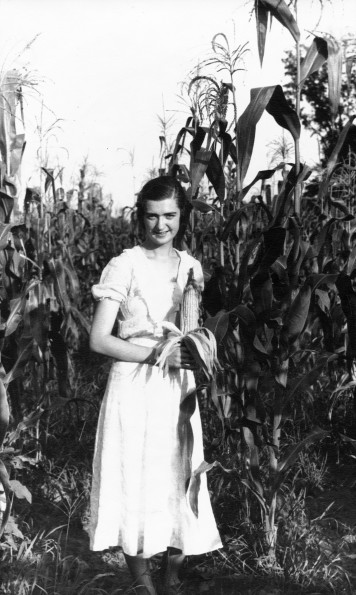 [Ellen A. Low standing in the corn field at Madison College]