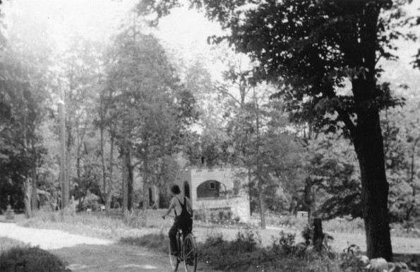 [Unknown boy riding his bike near John R. Peter's house in Pewee Valley, KY]