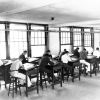 [Professor Standish with unknown students in Drafting class at Madison College]