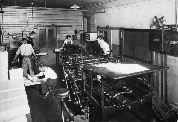 [Unknown people working in the Press Room in the Print Shop at Madison College]