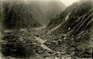 Narrow valley filled with buildings built in the traditional Chinese style.