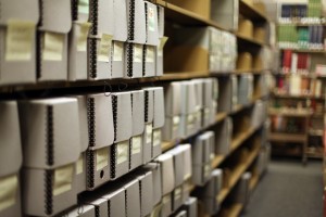 White Document File boxes in their storage location in the stacks area of the Center for Adventist Research.
