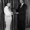Edward C. Banks receiving an honorary plaque from Richard Hammill