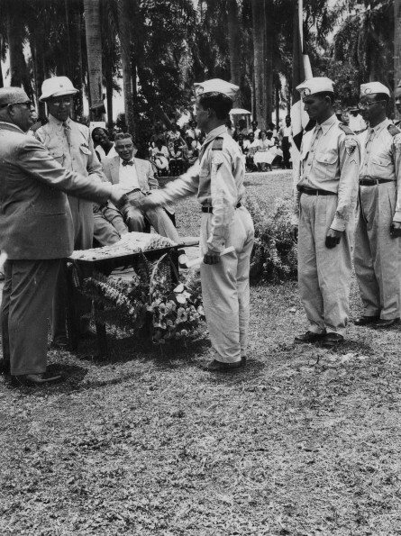 Medical cadets receiving diplomas from the treasurer of the Red Cross in the Dominican Republic