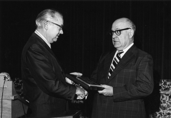 J. Paul Laurence receives an award for 25 years of outstanding service as principal of Takoma Academy in Takoma Park, Maryland