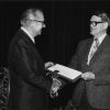 Lawrence E. Smart is presented with an award in recognition of the 36 years of service to Seventh-day Adventist education