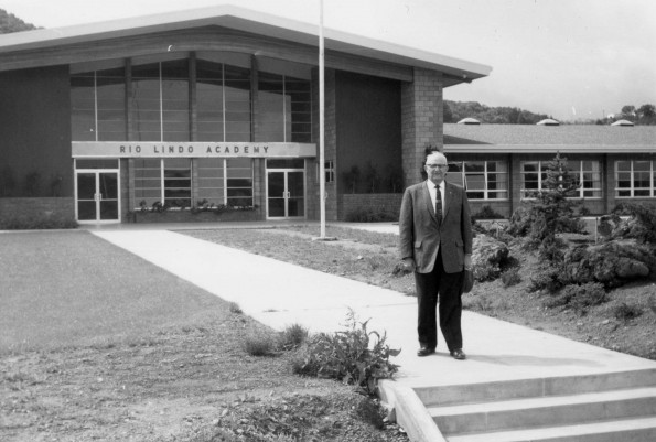 Carl Becker standing in front of Rio Lindo Academy, 1960s