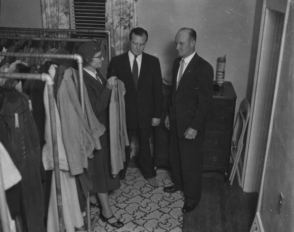 Seventh-day Adventist Community Services volunteer displays clothes to be given to those people in need