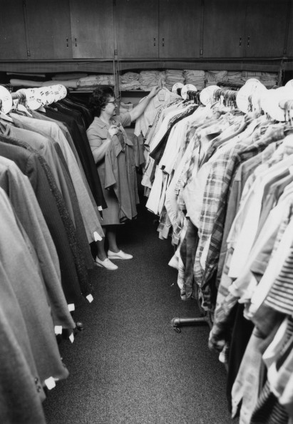 Clothing for a family in need is selected by Berrien Springs Community Services Center Director, Mrs. Ben Schoun