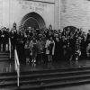 Group of people on the steps of the Pioneer Memorial Seventh-day Adventist Church who are planning to begin the Stevensville Seventh-day Adventist Church the following Sabbath