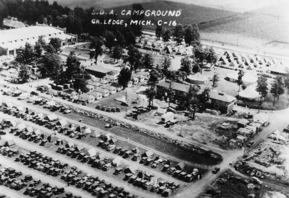 Grand Ledge Seventh-day Adventist Camp aerial view showing parking lot, tents, and other buildings, 1930s