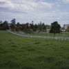 Avondale College showing entrance road and college buildings and Sanitarium Foods factory in the distance, 1995