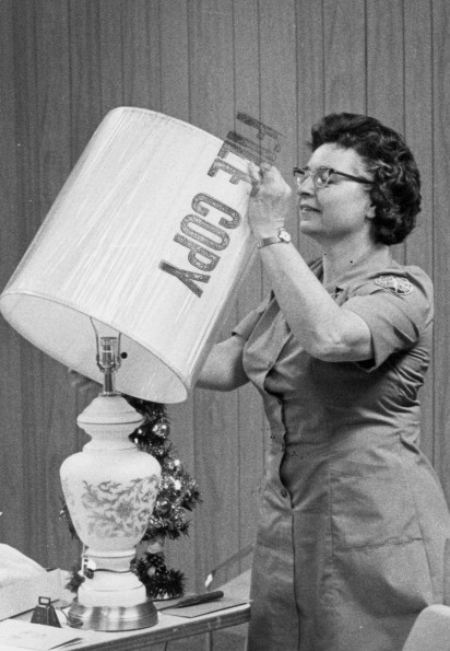 Berrien Springs Community Services Center Director, Elizabeth Schoun, opens surprise birthday presents